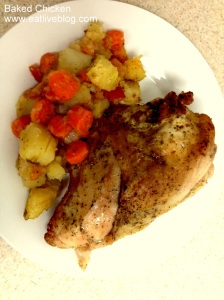 Plated baked, bone-in chicken breast with carrots and potatoes